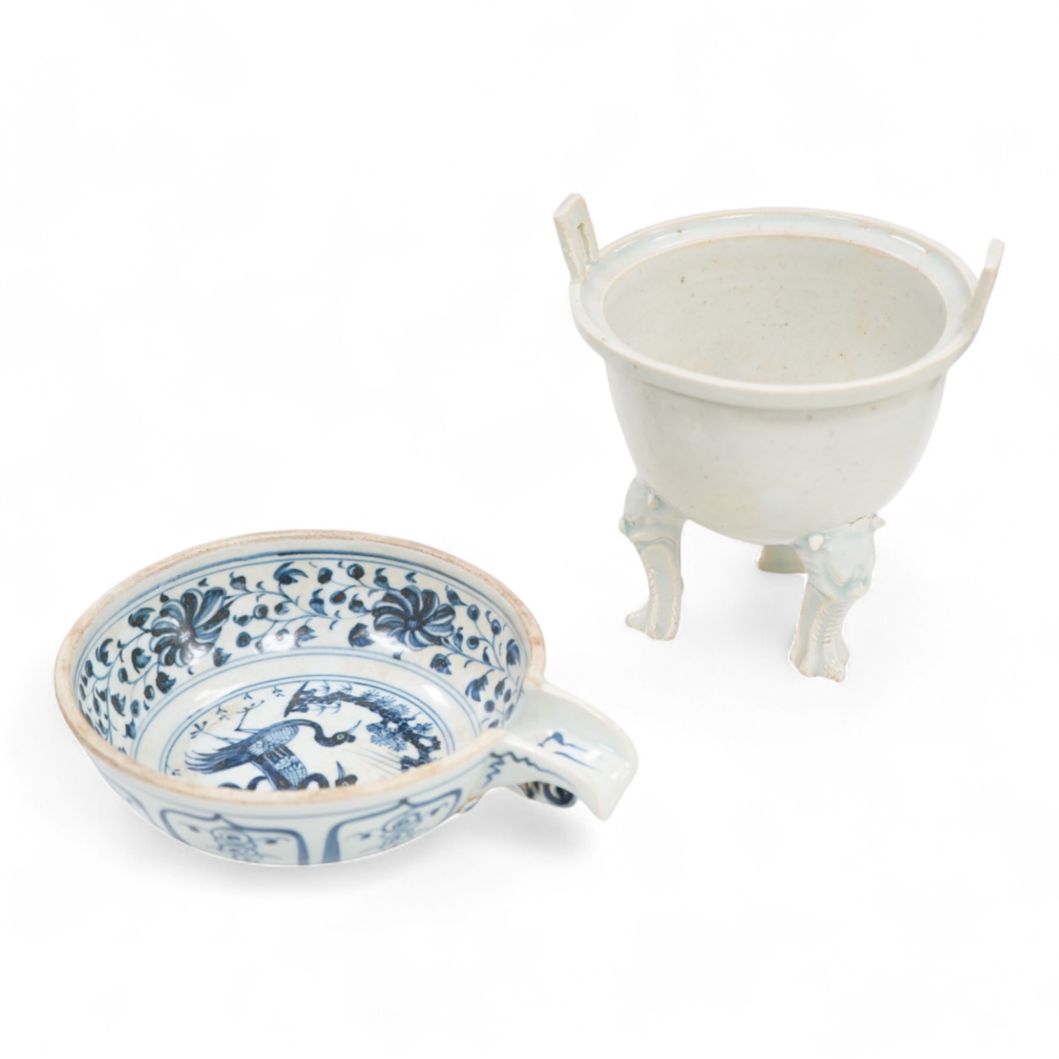 A Chinese three footed censer and a blue and white pouring bowl, largest 15cm high